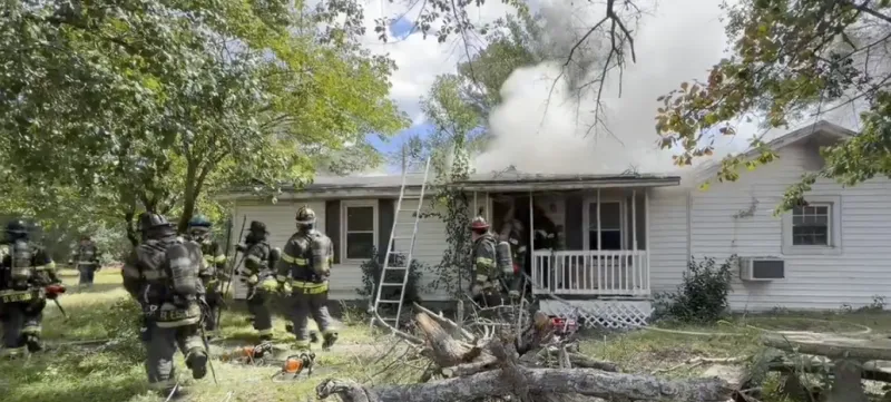Firefighters work to bring fire under control at Louis Lee Lane home