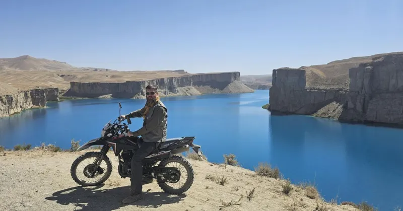 In the Air Force he helped Americans flee Afghanistan. 5 years later he went back, on a motorcycle.