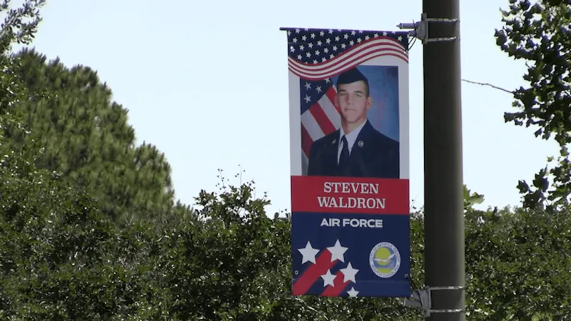 Military banners honoring veterans, active-duty service members available for pickup