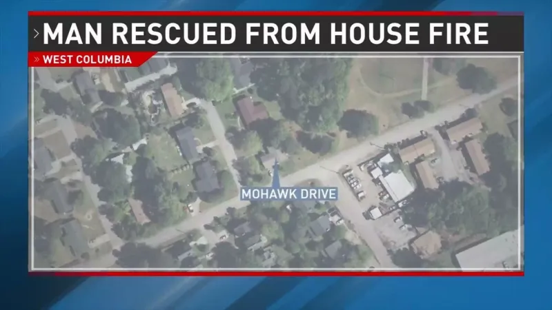 Firefighters pull man from burning West Columbia home