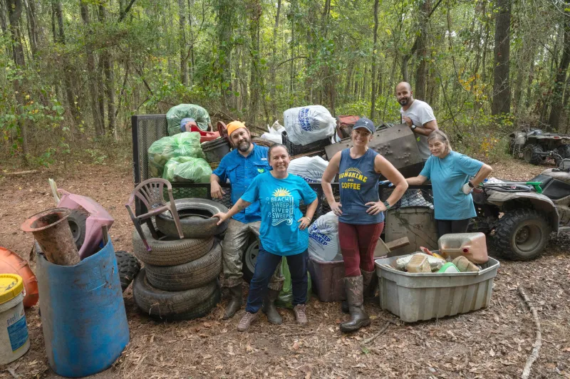 Volunteers join river sweep trash cleanup