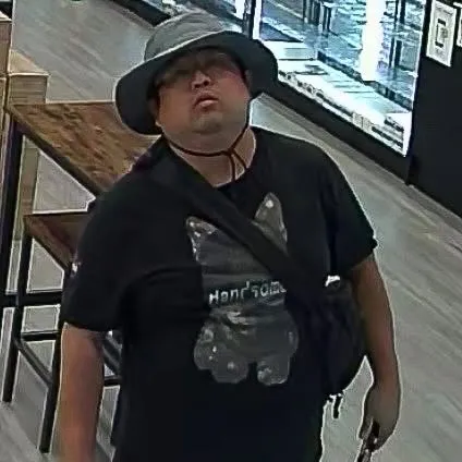 Lexington Police need help identifying someone accused of fraudulently buying Pokmon cards