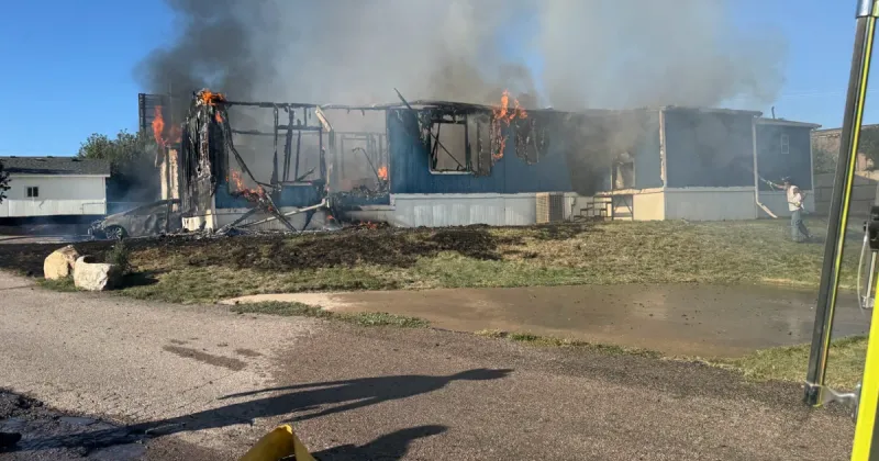 Two families displaced after fire takes mobile homes, car