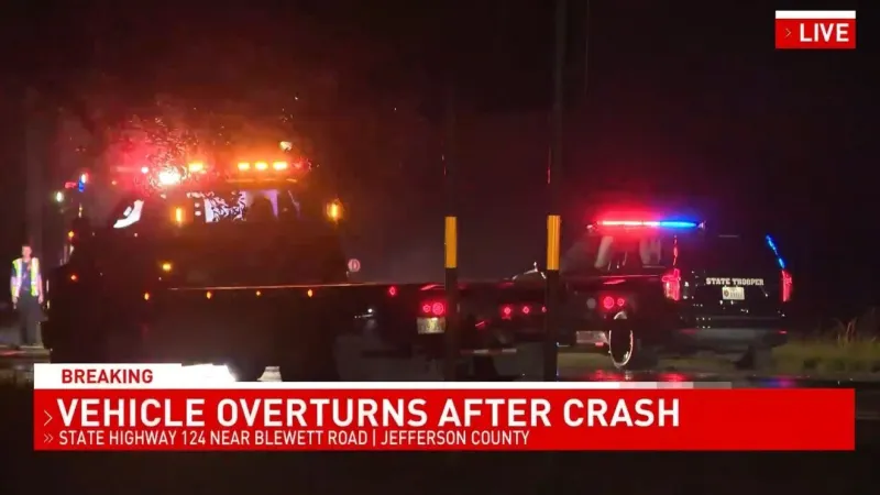 First responders help get driver out of overturned pickup truck after crash