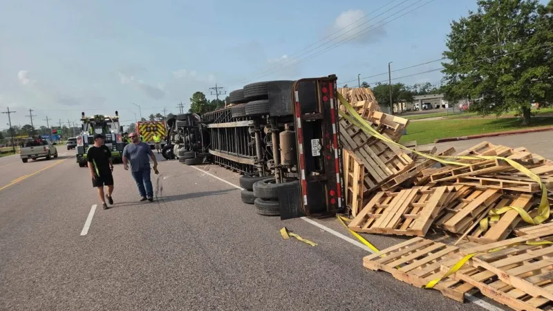BREAKING: 18-wheeler carrying pallets overturns on first day back to school in Lumberton