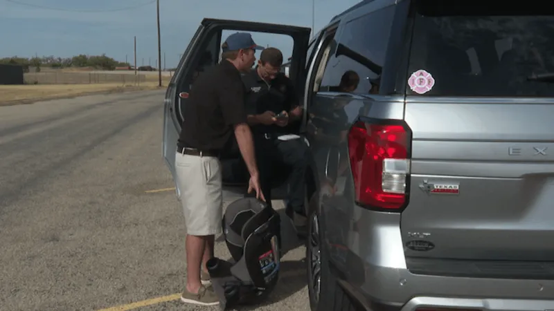 Families receive free car seat safety checks at community event