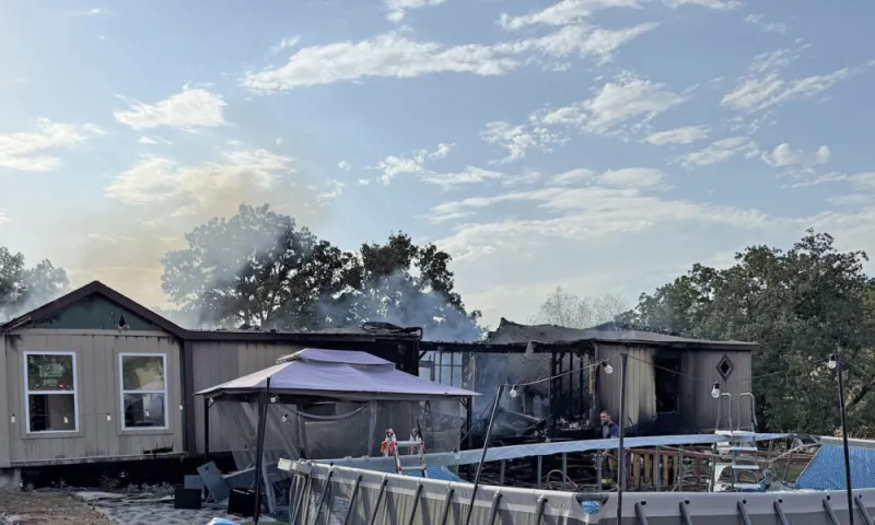 Home burns, 1 man jailed as arson suspect
