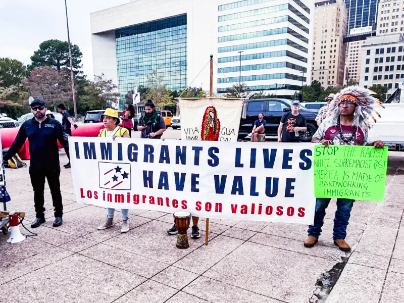Scenes and signs from the Dallas Against The Trump Agenda Coalition march