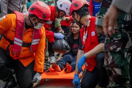 Families desperate for news as 129 still missing four days after capsize of ship in Indonesia's Java Sea