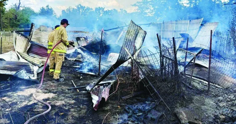 Free: Standing and fighting the fire: Two fires caused by illegal burning destroy acres and buildings