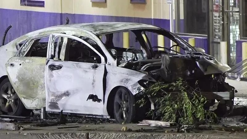 Mysterious accident leaves car destroyed by fire, power pole split in half