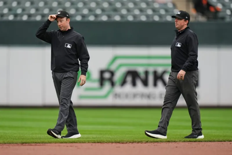 Twin brothers Austin and Tyler Jones ump big league games together for the first time