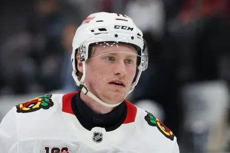 Blackhawks sign F Oliver Moore to 5-year deal