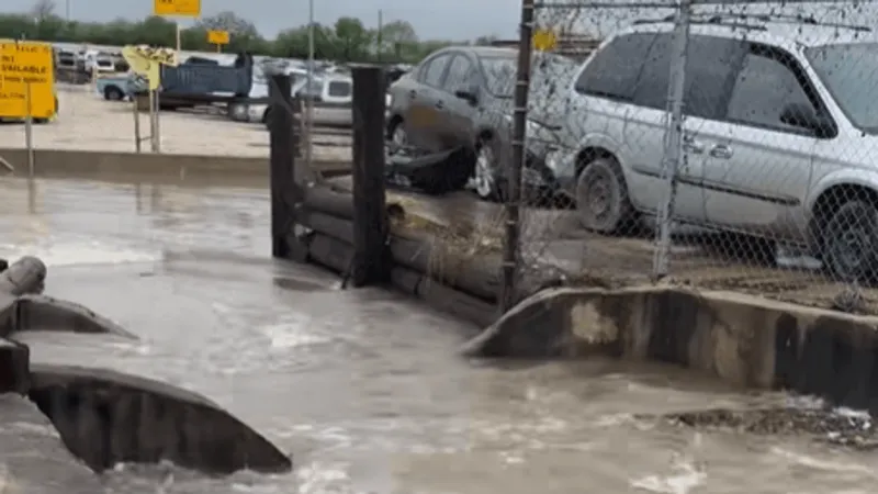 South Side Pick-n-Pull closes for the day after flooding covers lot in mud, water