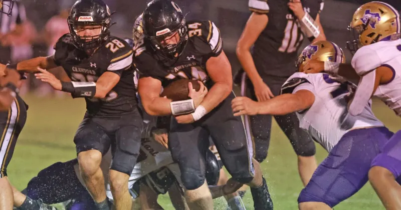 Crawford sloshes past Mart, 20-13, in soggy slugfest