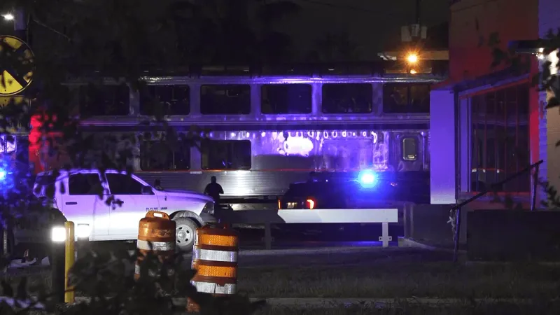 Driver killed when car struck by Amtrak train at railroad crossing, police investigate