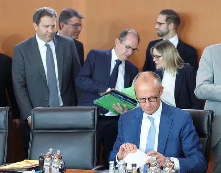German coalition affirms reform agenda amid 'historic test' for democracy