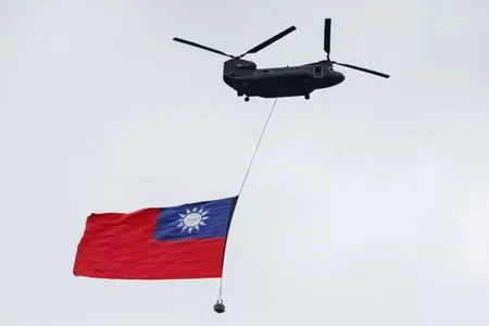 Giant Taiwan flag flies from helicopter for national day, defying Beijing