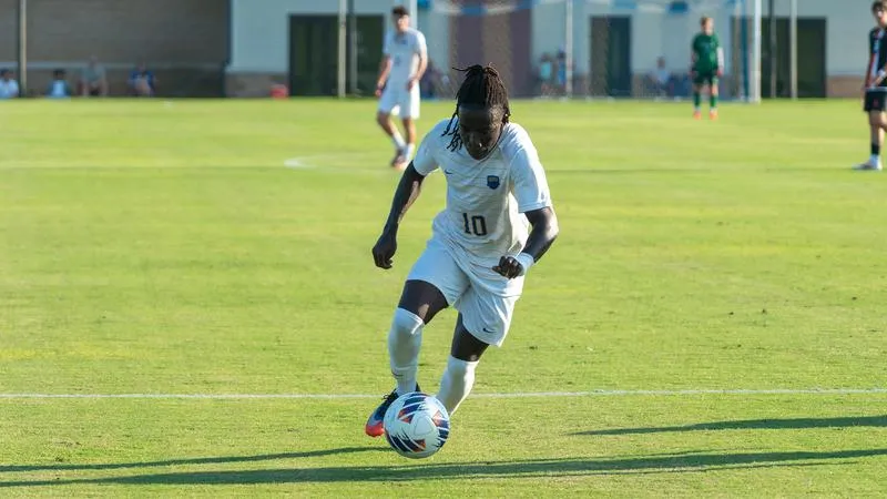 Mwambukiri's Hat Trick Powers Men's Soccer to First Conference Win