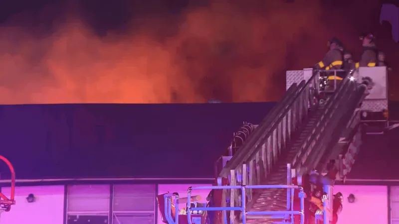 LIVE: Firefighter falls through floor as 3-alarm fire tears through vacant apartments