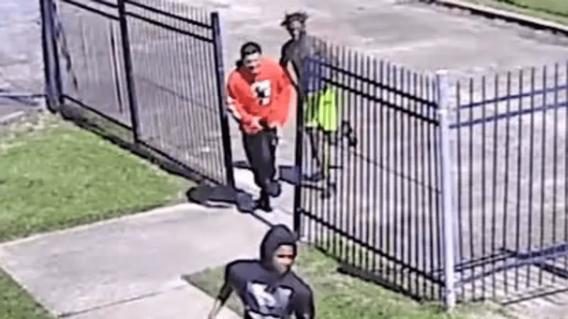 Victim robbed at gunpoint, surveillance video captures images of suspects