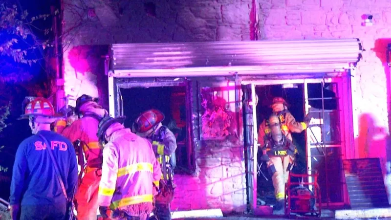 Crews forced to cut through security doors to battle West Side convenience store fire