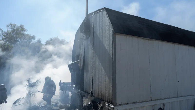 Trash fire in south Travis County spreads to nearby shed