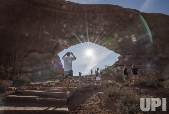 Tourists Visit Arches National Park in Moab, Utah