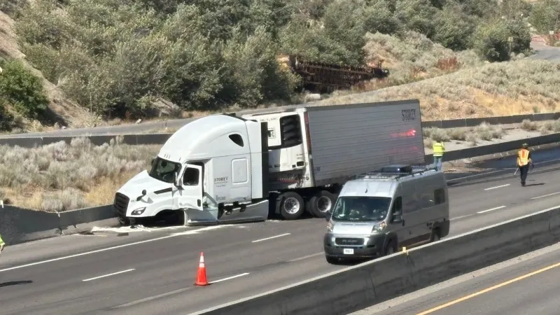 Semi hauling rolls of carpet jackknifes on I-80 in Parleys Canyon