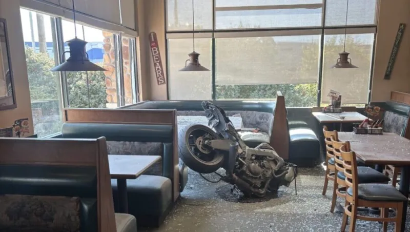 Accident sends motorcycle through window of Draper business