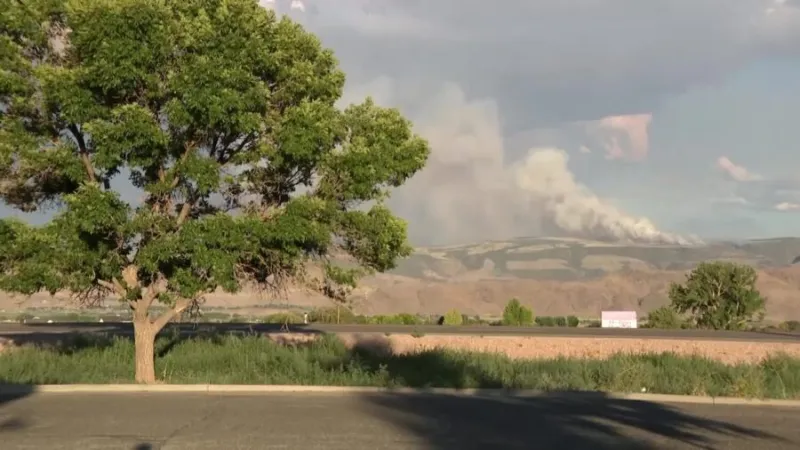 'It's going to break a lot of people's hearts': Monroe residents watch as fire burns beloved mountain