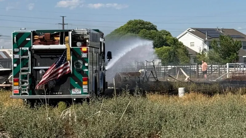 Fast-moving grass fire under control after threatening Tremonton structures