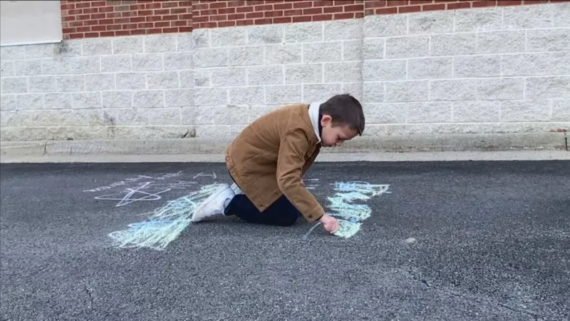 Kids turn hateful graffiti at Loudoun County shopping center into messages of love, hope