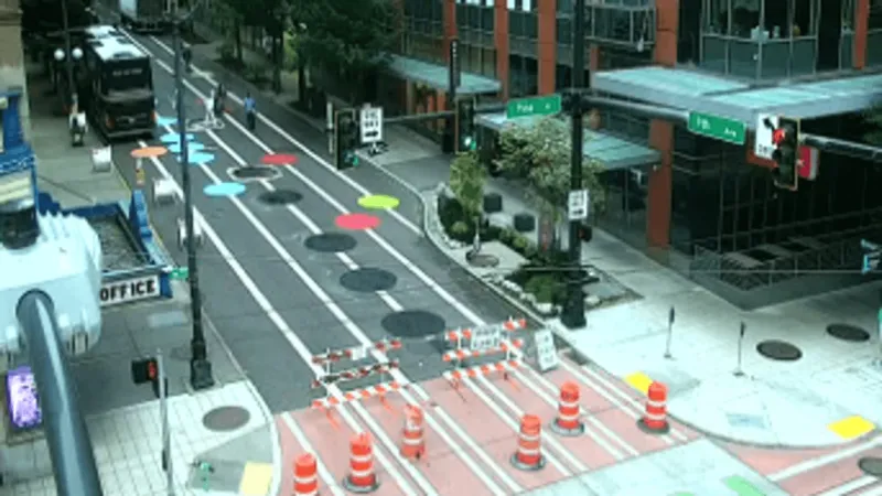 Crews begin to paint over 9th Avenue dot artwork as downtown street closure continues