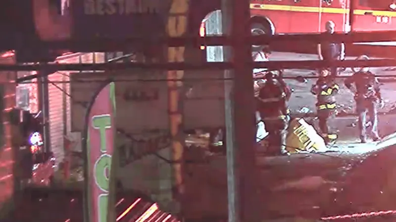 Driver knocks down power pole, crashes into building in north Seattle