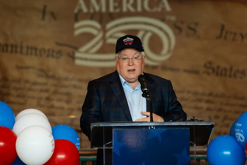 Governor touts America 250 merch and bell-ringing ceremony