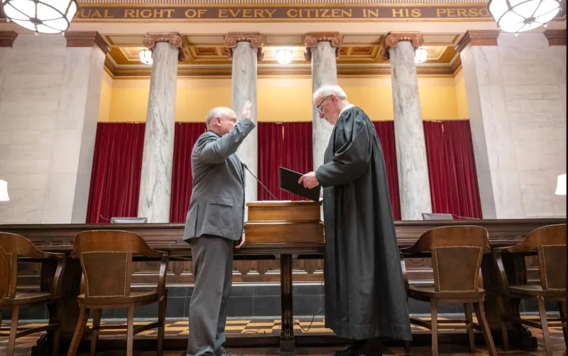 Flanigan takes oath of office, joins High Court