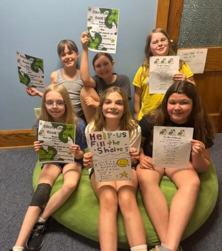 Girl Scouts helping with library fundraiser