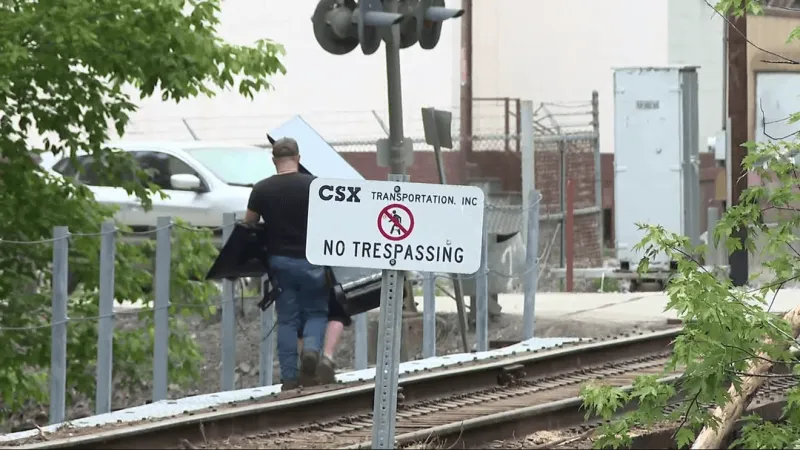 Flooded residents near Wharton forced to cross railroad trestle after bridge destroyed