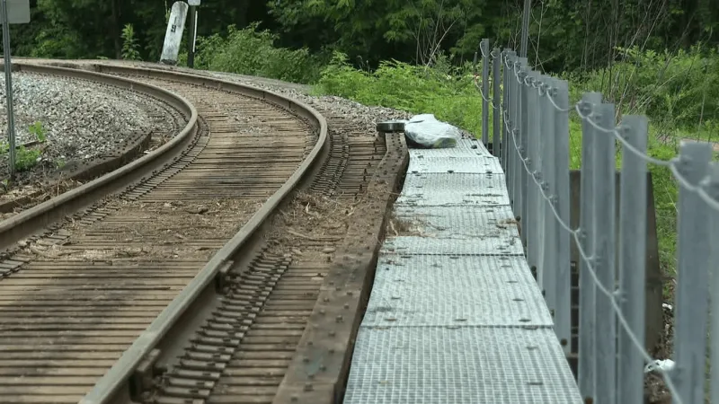 Fire chief drives pickup across trestle to rescue elderly woman and daughter