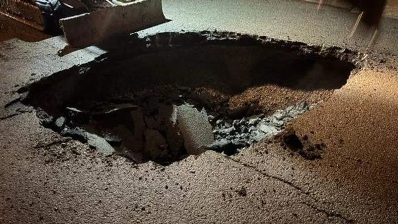 Floodwaters form sinkhole on busy roadway in Prestonsburg, Ky.
