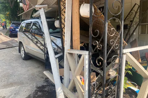 Two Individuals Taken to United Hospital Center after Vehicle Runs into Porch on Clarksburg's Milford Street
