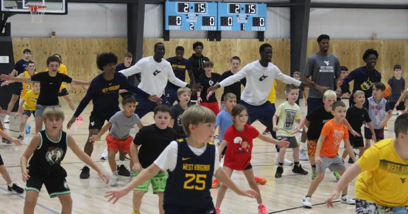 WVU Men's basketball team visits Logan for free youth camp