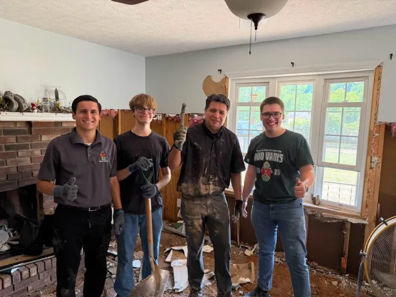 New Diocese bishop lends helping hand in flood-ravaged Weston