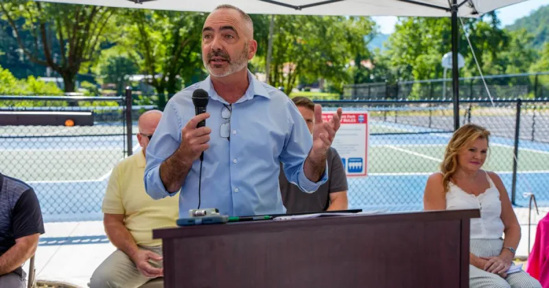 Man opens courts, breaks ground on splash pad at riverfront park