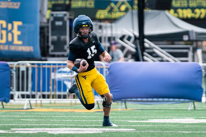 Rich Rodriguez staying quiet on naming WVU's starting QB, isn't opposed to using 2