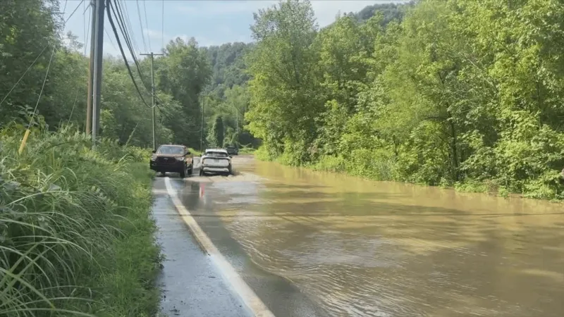 Flash flooding in Cabin Creek blocks roads, traps residents