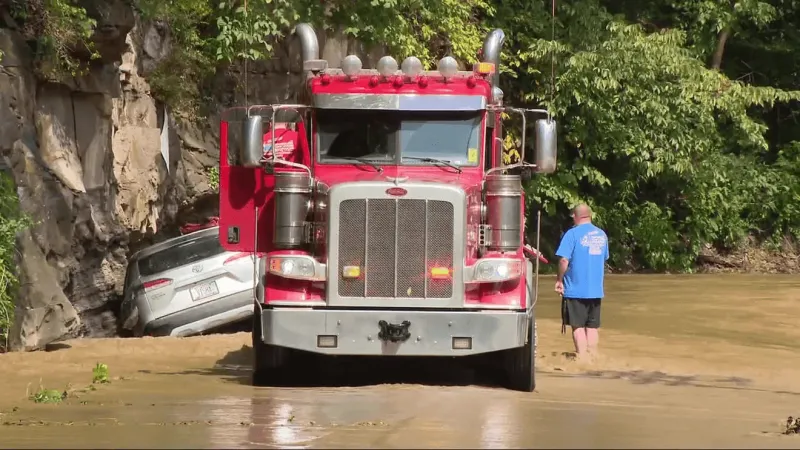 Paint Creek spills out of banks from heavy rains, flooding roads and damaging properties
