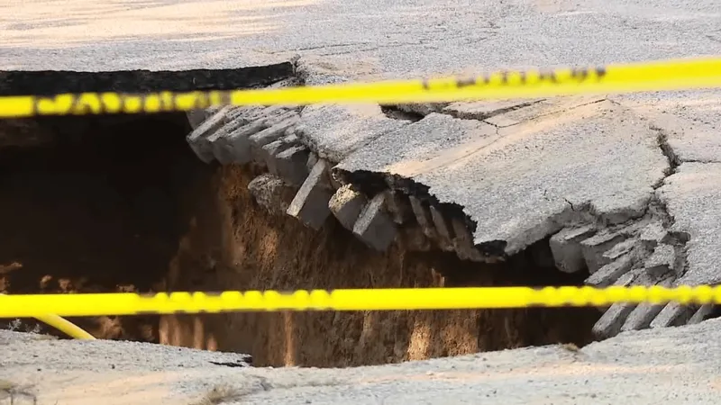 Sinkhole opens on West 7th Street after water line break in Huntington
