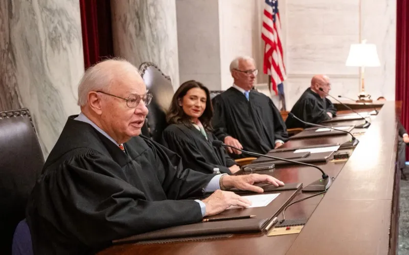 Wooton treated for dehydration, back to work at Supreme Court